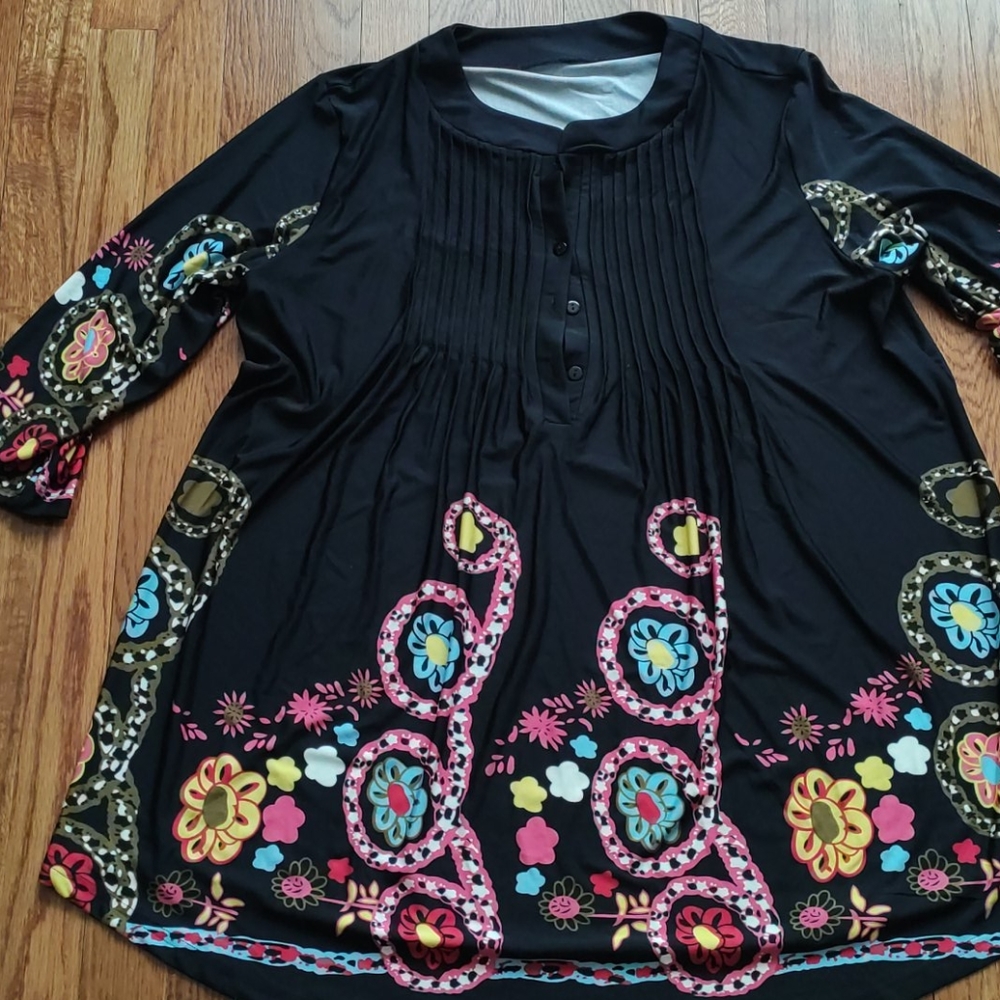 Woman's black pleated floral blouse